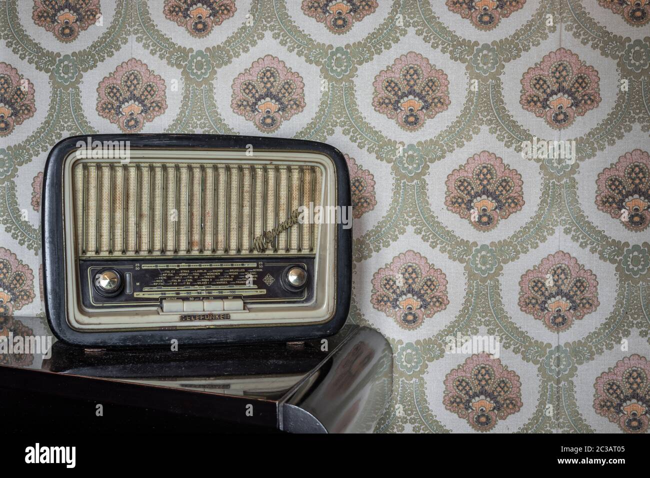 March 1, 2020 - Rome, Italy - Telefunken Mignonette, an old transistor radio,  with knobs and buttons for manual tuning. In the background a vintage wa  Stock Photo - Alamy