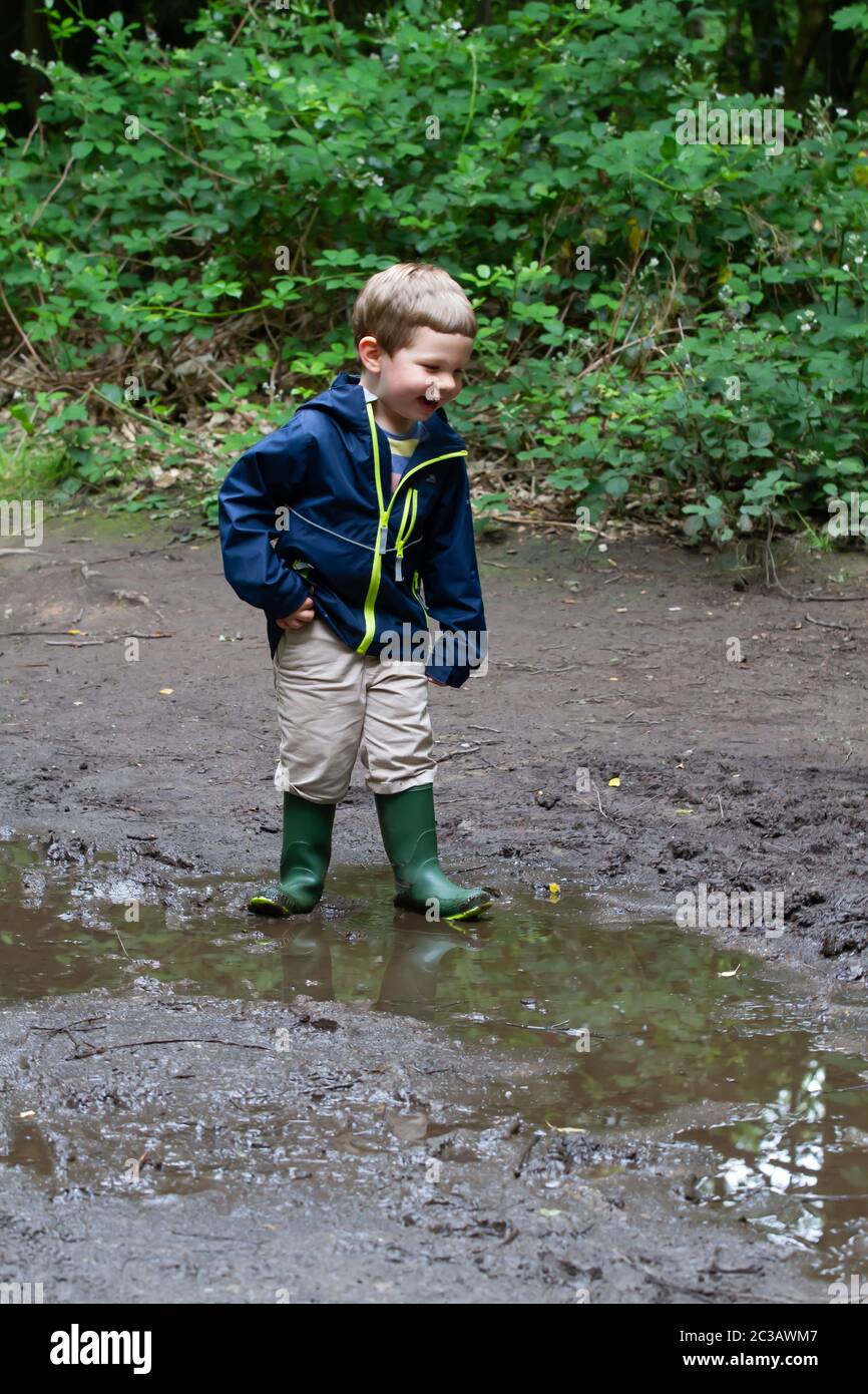 Children jumping in puddles hi-res stock photography and images - Alamy