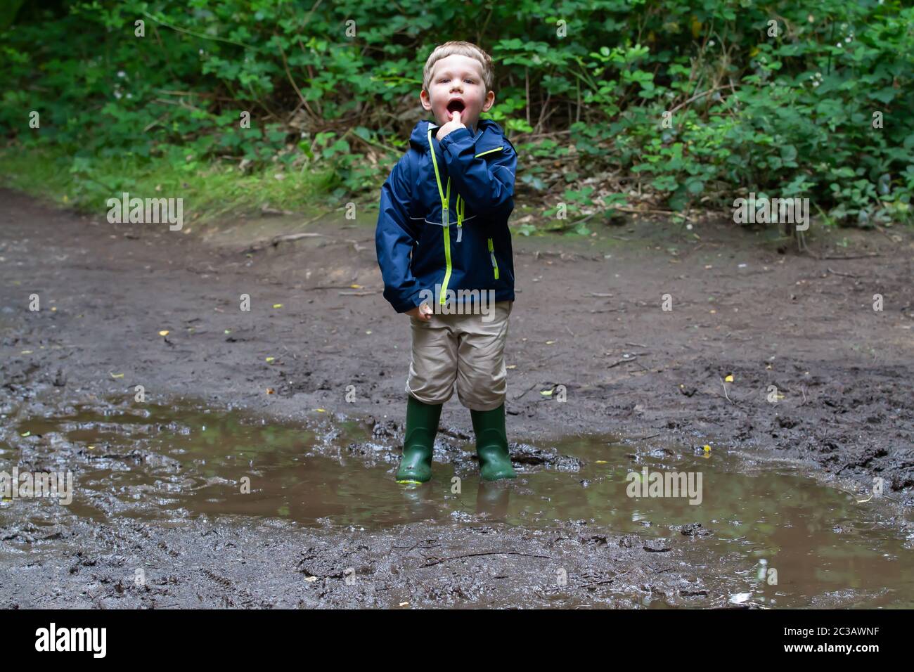 Children jumping in puddles hi-res stock photography and images - Alamy