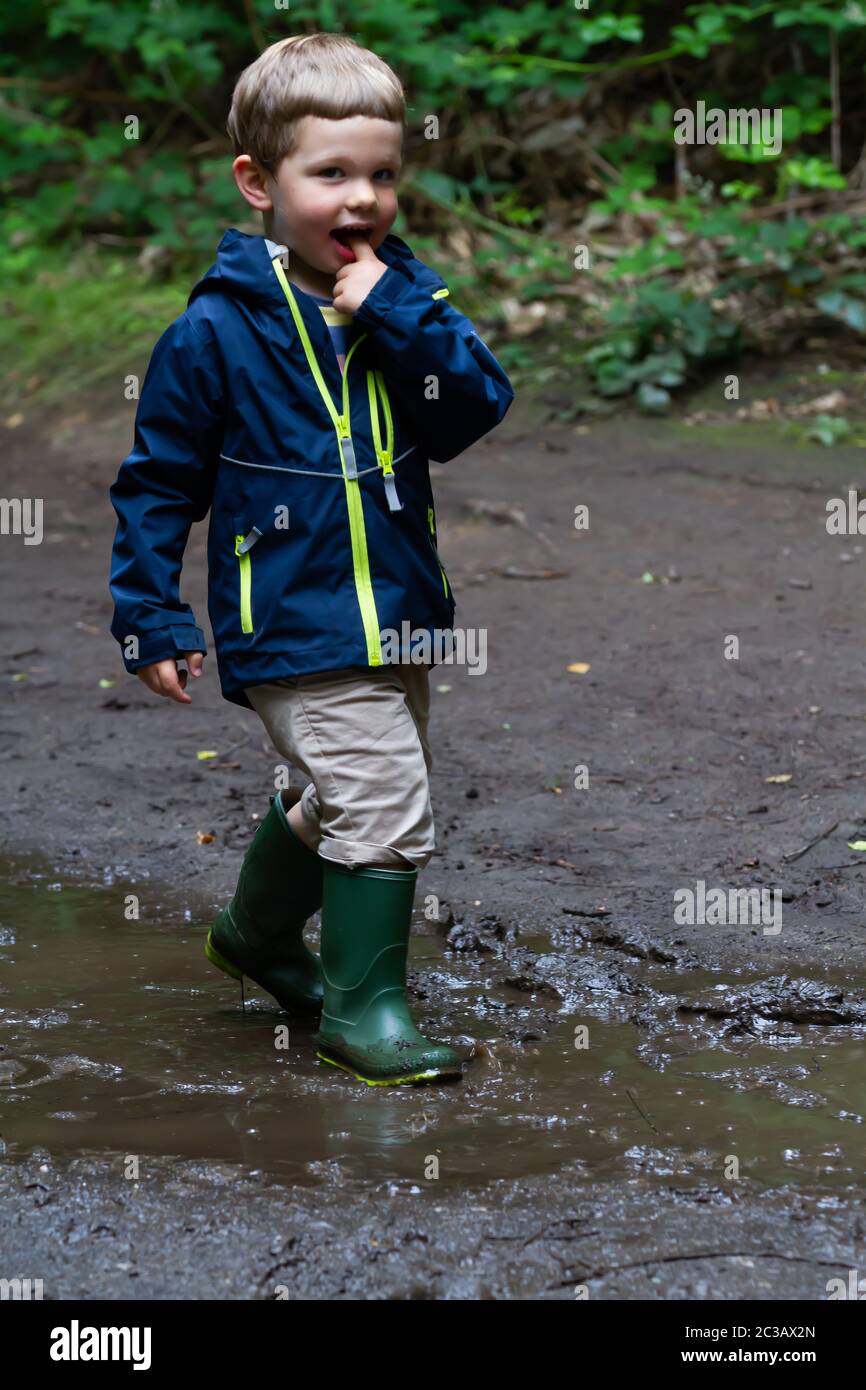 Children jumping in puddles hi-res stock photography and images - Alamy