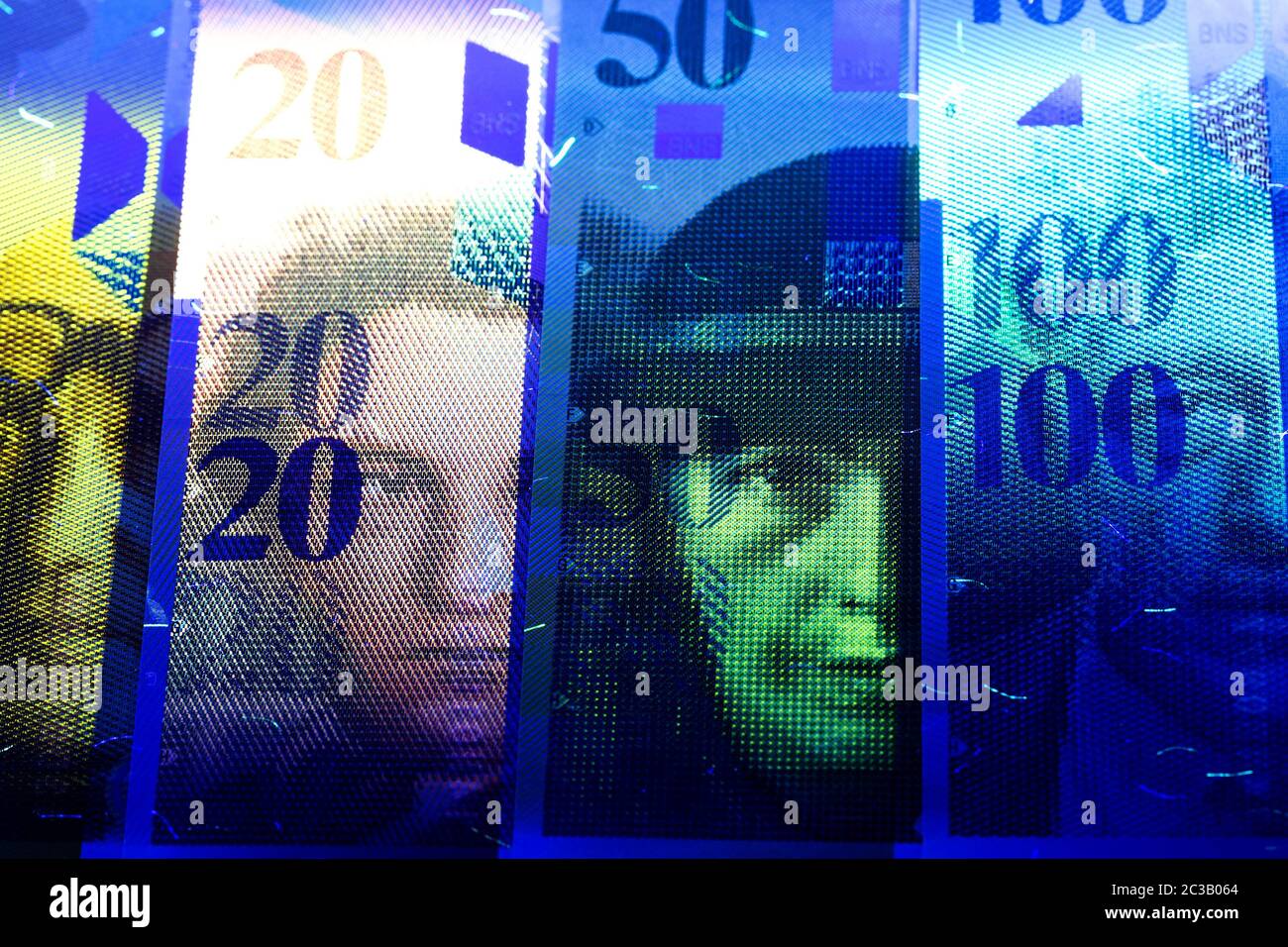 Swiss money in UV rays Stock Photo