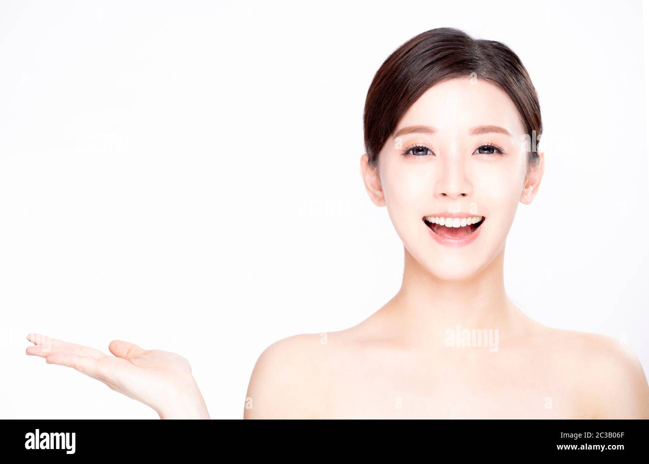 young beauty showing empty copy space on the open hand palm Stock Photo ...