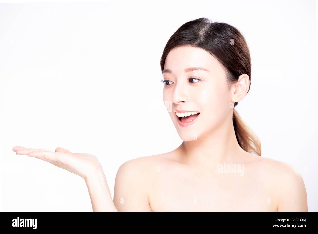 young beauty showing empty copy space on the open hand palm Stock Photo ...