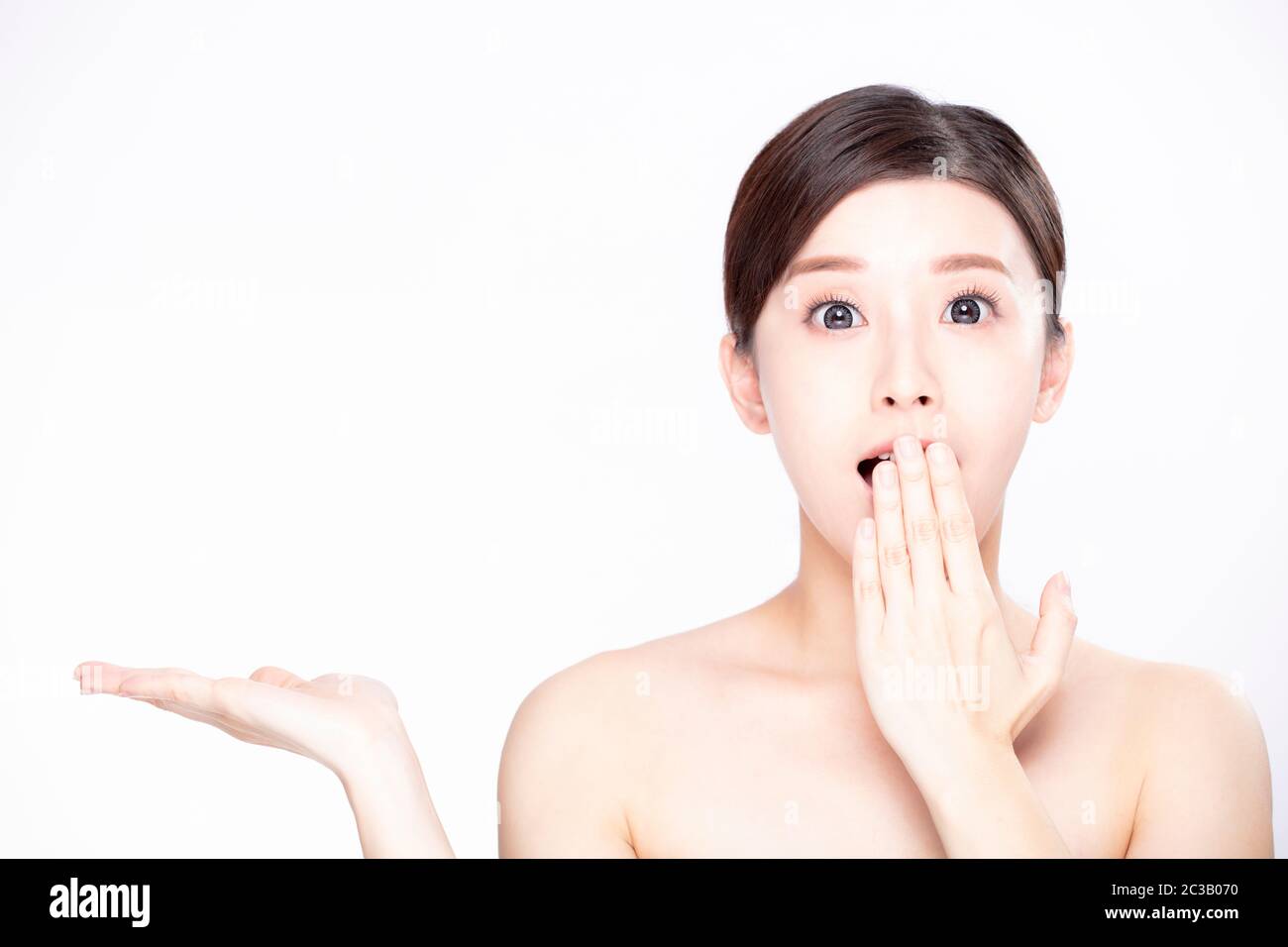 young beauty showing empty copy space on the open hand palm Stock Photo ...