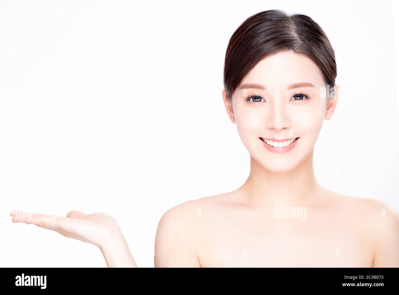 young beauty showing empty copy space on the open hand palm Stock Photo ...