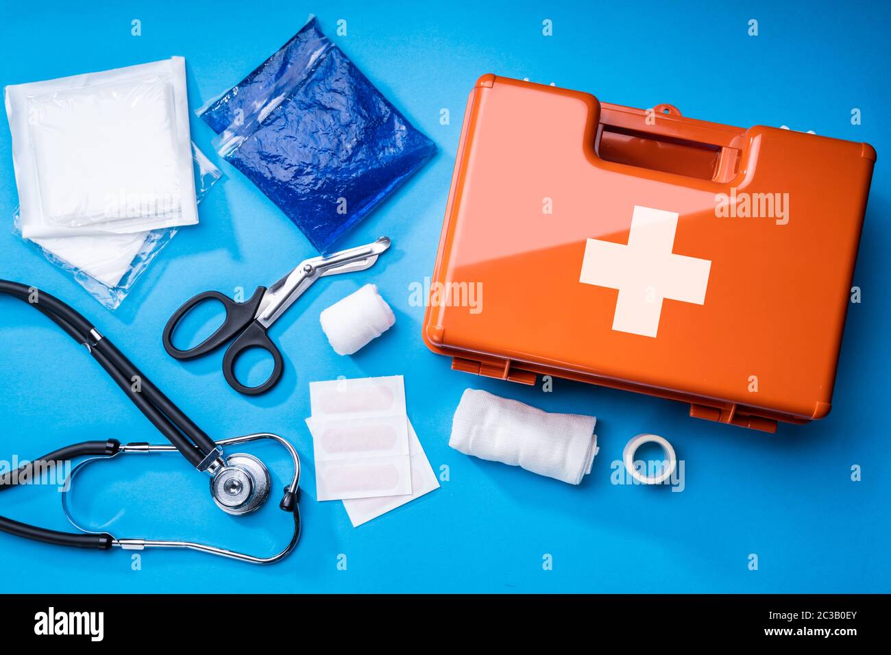 First Aid Kit With Medical Equipment On Blue Background Stock Photo Alamy
