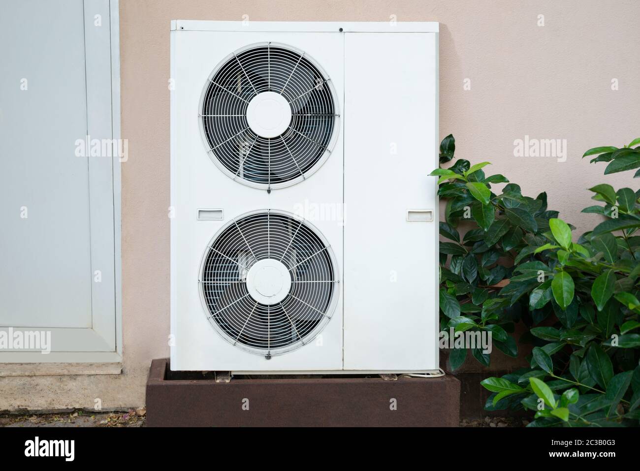 Air Conditioner Unit Standing Outside Of The House Stock Photo - Alamy