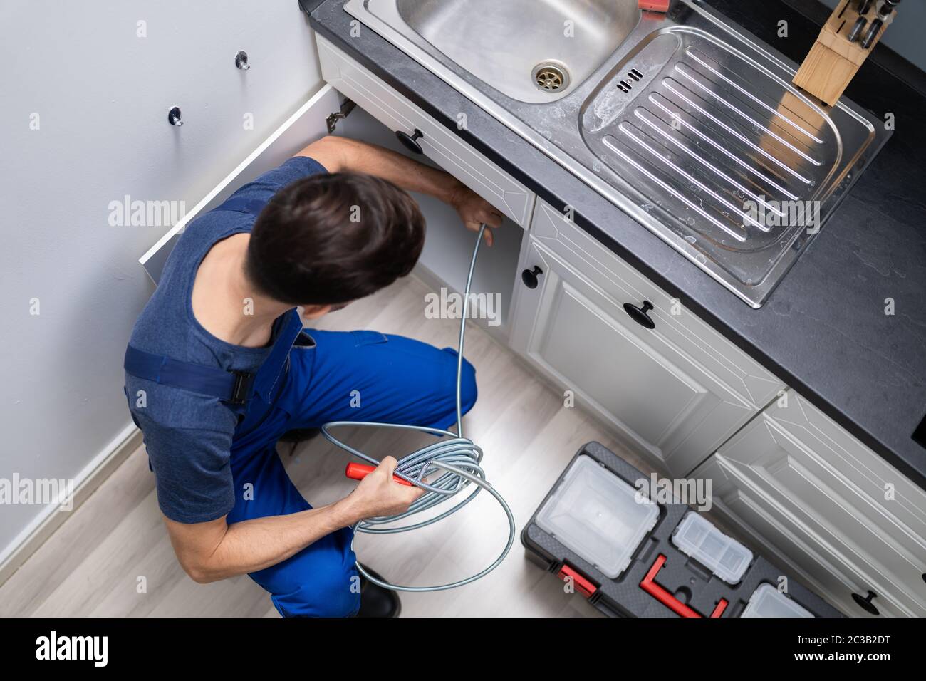 Fixing clogged drain hi-res stock photography and images - Alamy