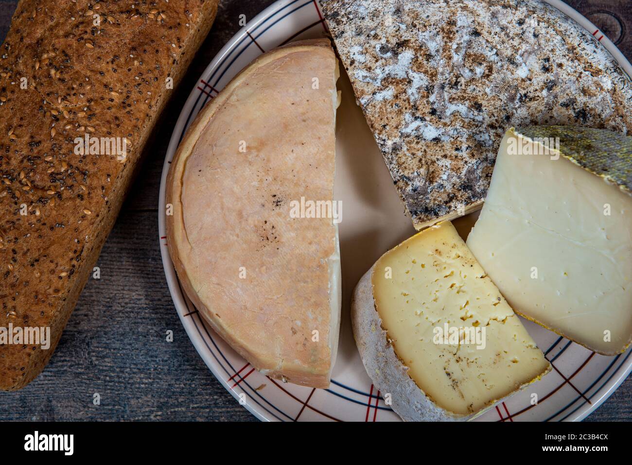 cheeses and Tomme de Savoie, French cheese Savoy, the french Alps France. Stock Photo