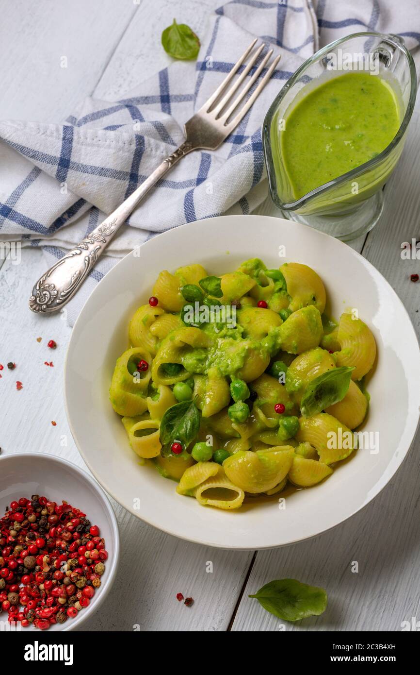 Pipe Rigate pasta with green pea sauce Stock Photo Alamy