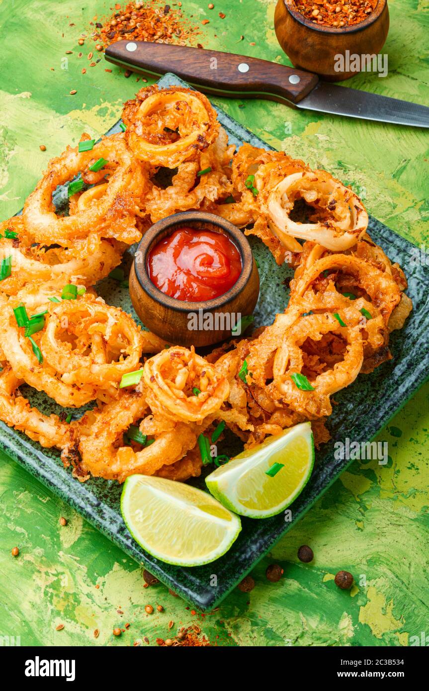 Crunchy deep fried squid rings in batter Stock Photo - Alamy