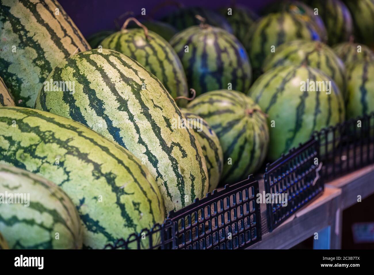 Huge watermelons for sale in a fruit and vegetable shop on the street in Zigong, China Stock Photo