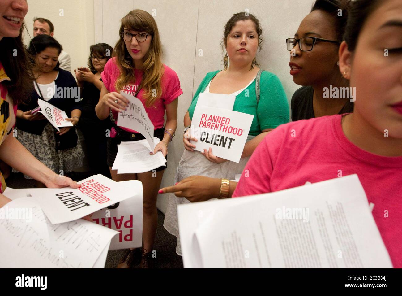 Austin, Texas USA, September 4 2012:  Supporters of women's health care provider Planned Parenthood attend a Texas Department of State Health Services public hearing on a rule to exclude Planned Parenthood from participating in its Woman's Health Program.  ©MKC/ Daemmrich Photos Stock Photo