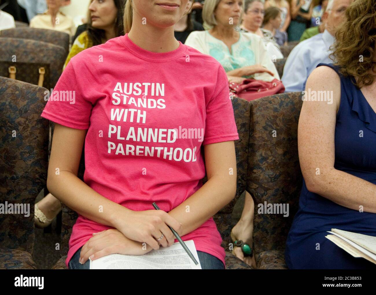 Austin, Texas USA, September 4 2012:  Supporters of women's health care provider Planned Parenthood attend a Texas Department of State Health Services public hearing on a rule to exclude Planned Parenthood from participating in its Woman's Health Program.  ©MKC/ Daemmrich Photos Stock Photo