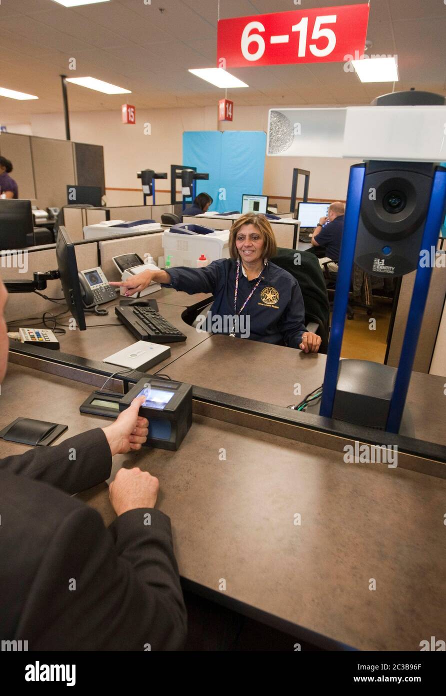 Pflugerville Texas USA, October 2012 Customer gets fingerprinted to