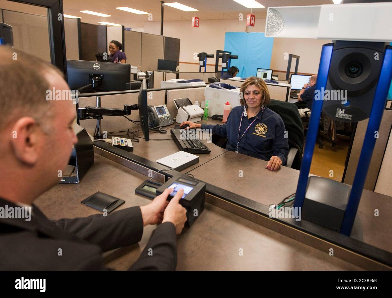 Pflugerville Texas USA, October 2012 Customer gets fingerprinted to
