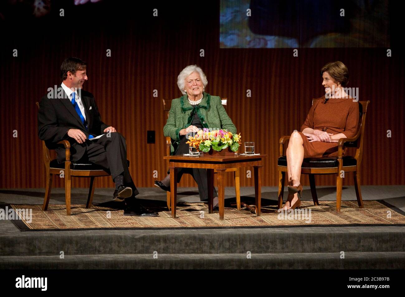 November 16th, 2012 Austin, Texas USA: Former First Ladies Barbara Bush (center) and  Laura Bush during 'The Enduring Legacies of America's First Ladies' conference at the LBJ Presidential Library. Moderator Mark Updegrove sits on the left side.  ©MKC / Daemmrich Photos Stock Photo