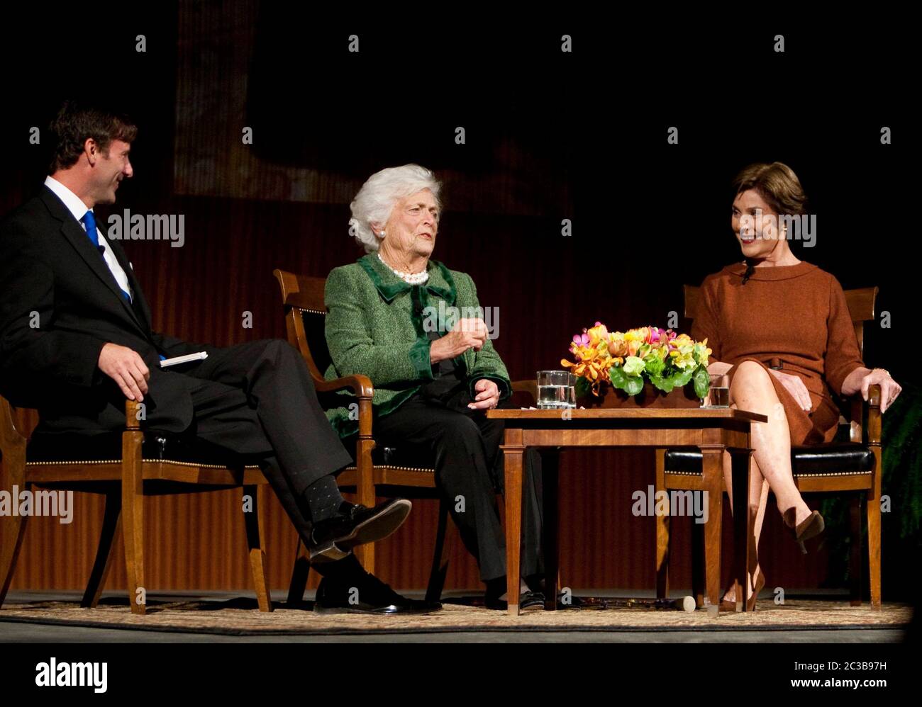 Austin, Texas USA, November 16, 2012: Former First Lady Barbara Bush (center) speaks to her daughter-in-law, former First Lady Laura Bush, and moderator Mark Updegrove during 'The Enduring Legacies of America's First Ladies' conference at the LBJ Presidential Library. ©MKC / Daemmrich Photos Stock Photo