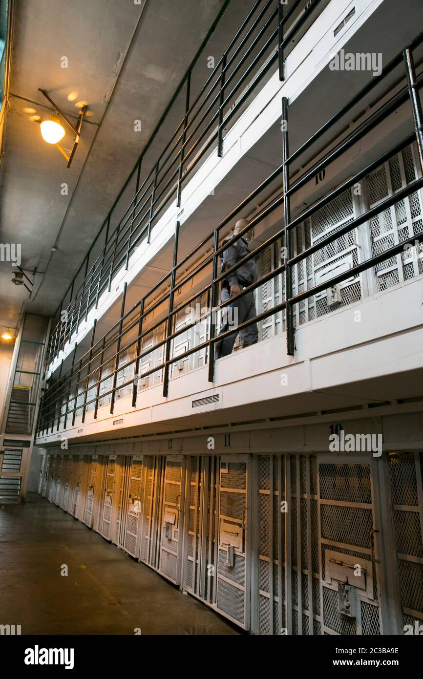 Rosharon Texas USA, August 26 2013: Prison guard walks his beat on elevated cellblock at Darrington prison, a maximum-security unit of the Texas Department of Criminal Justice system. ©Marjorie Kamys Cotera/Daemmrich Photography Stock Photo