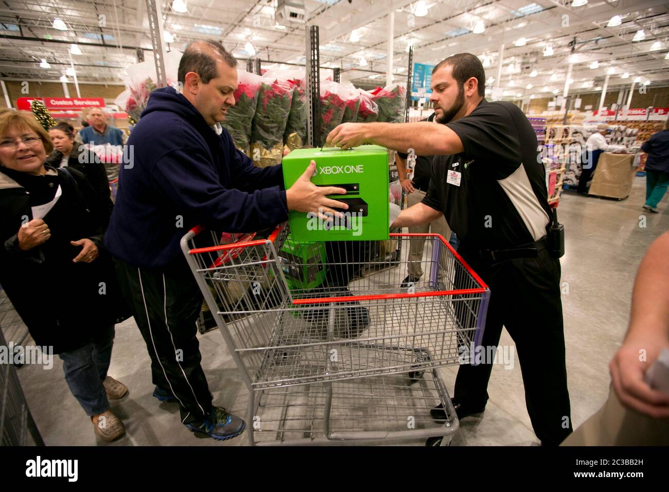 Cedar Park Texas USA, November 22 2013: Consumers take advantage of low prices for the popular XBox One gaming console, offered as a promotion to attract shoppers to opening day of a new Costco warehouse club in a fast-growing Austin suburb.   ©Marjorie Kamys Cotera/Daemmrich Photography Stock Photo