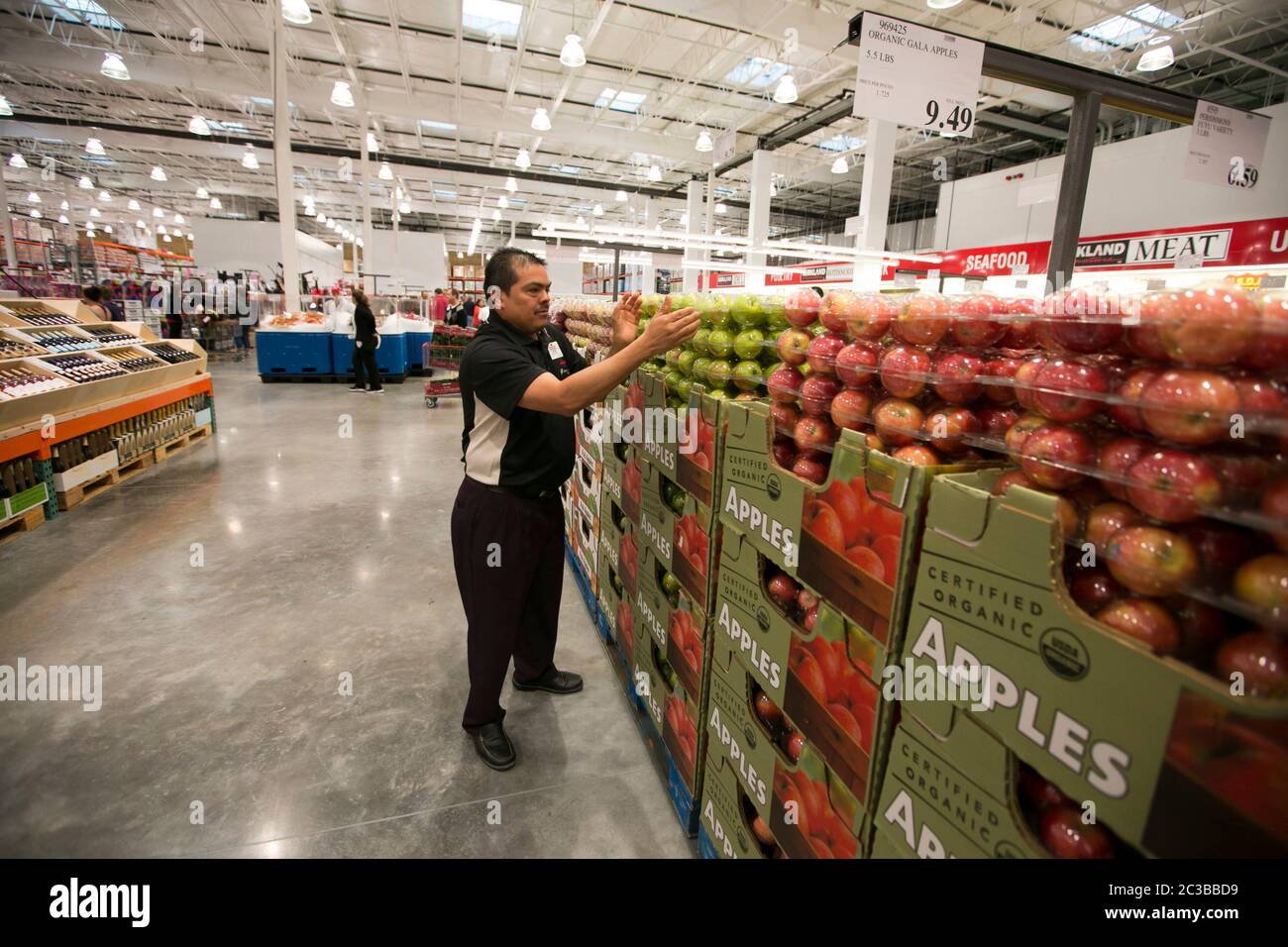 Costco - Costco warehouse club employees happily and enthusiastic take