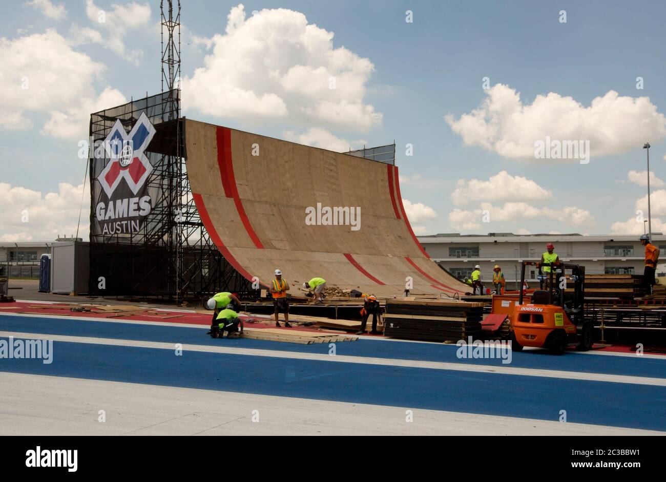 Austin Texas USA, May 29 2014: week before the annual X Games--a made-for-TV sports event--begin, workers hurry to finish construction on the Big Air ramp at the Circuit of the Americas motor sports venue. ©Marjorie Kamys Cotera/Daemmrich Photography Stock Photo