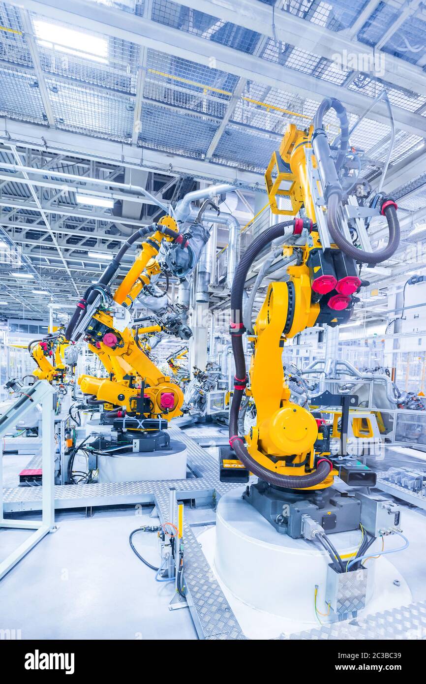 robotic arms in a car plant Stock Photo