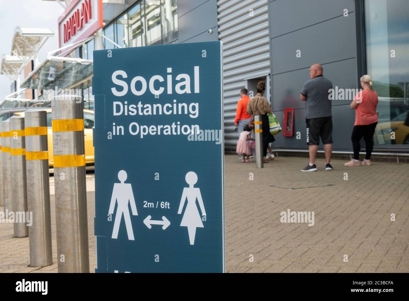 Edinburgh, Scotland, UK. 19 June, 2020. Several shops at Straiton Retail Park outside Edinburgh have opened. Signage warning customers to maintain 2m social distancing is positioned outside and inside shops. Iain Masterton/Alamy Live News Stock Photo