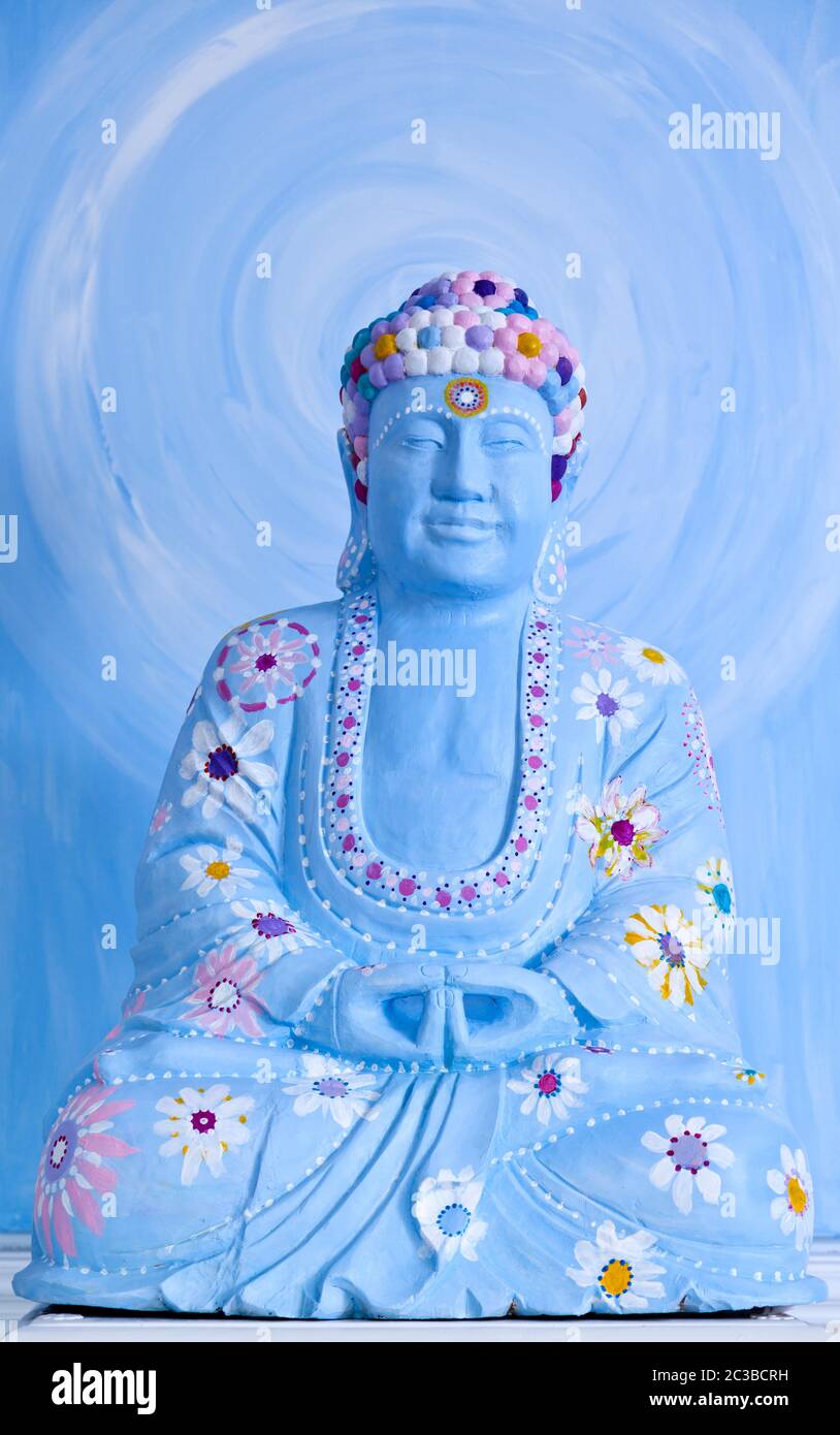 happy buddah in blue with colorful decoration Stock Photo