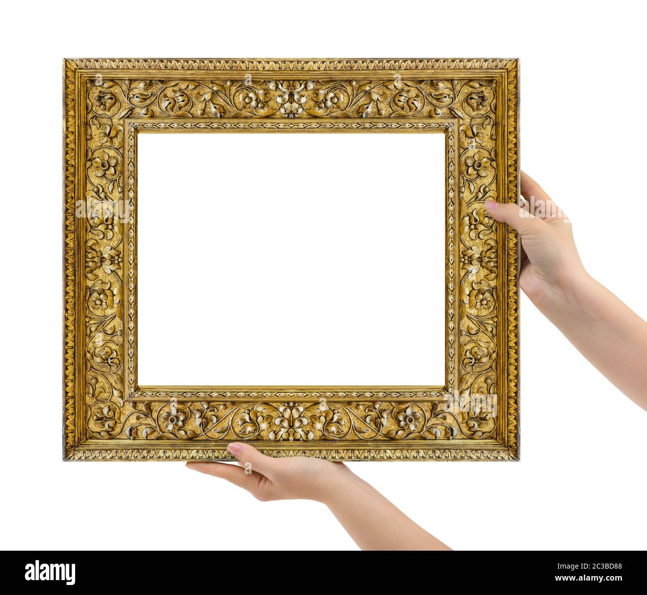Wooden picture frame in hands Stock Photo