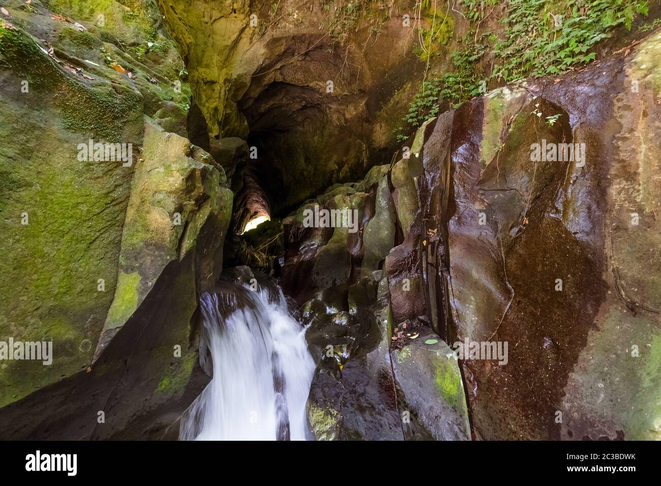 Cave and Rang-Reng Waterfall on Bali island Indonesia Stock Photo