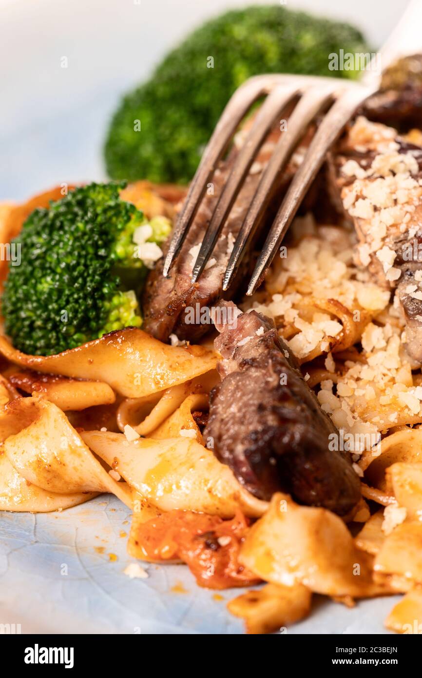 tagliatelli with steak slices on a plate Stock Photo