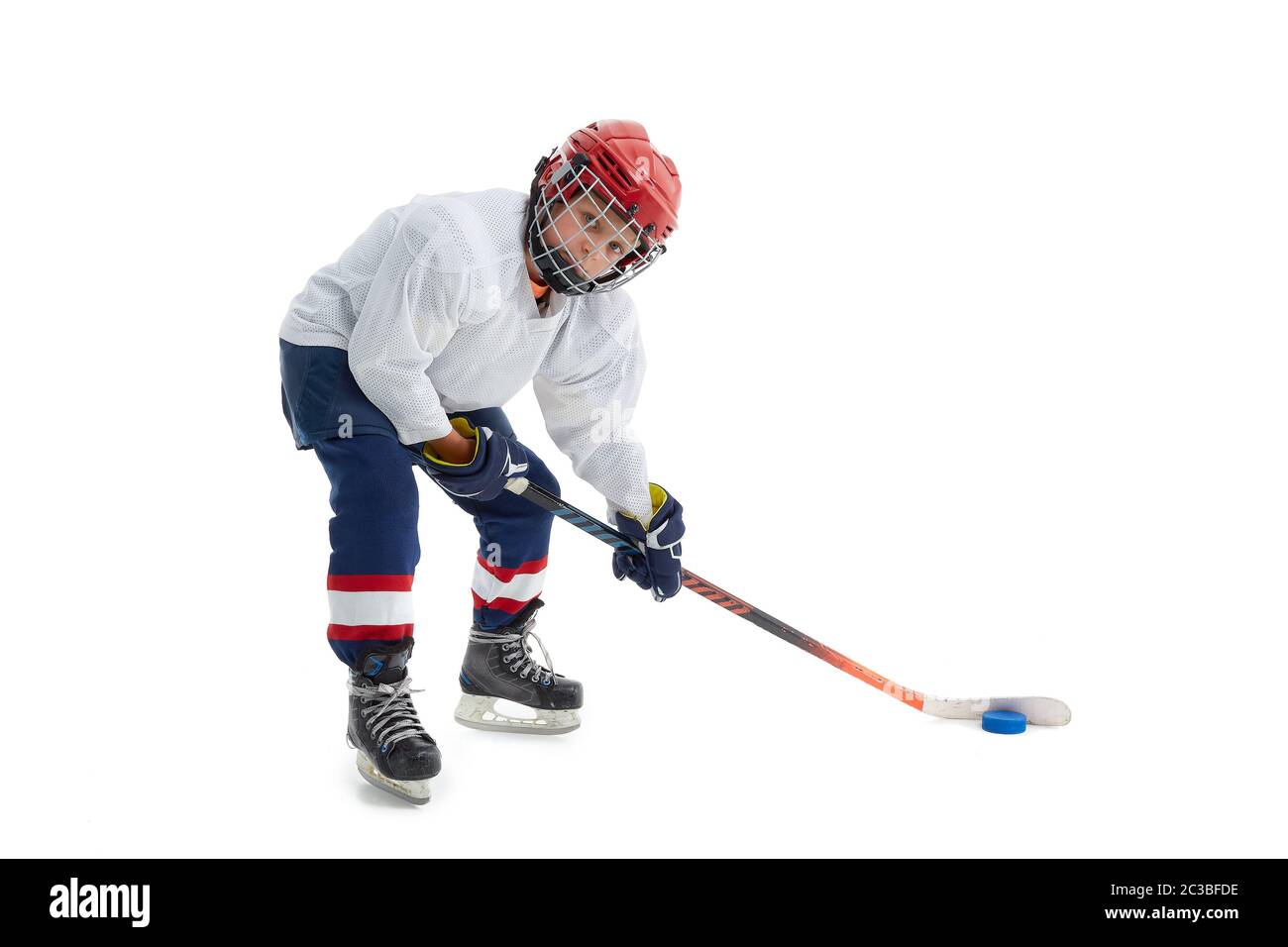 Junior ice hockey player . Child (boy) is hockey player in uniform