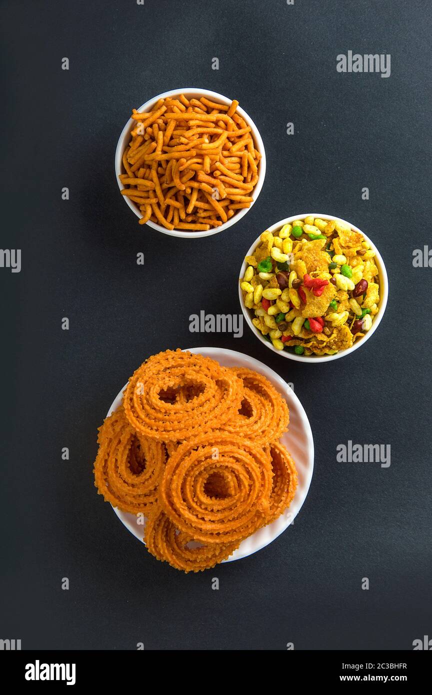 Indian Snack : Chakli, chakali or Murukku and Besan (Gram flour) Sev and chivada or chiwada. Diwali Food Stock Photo