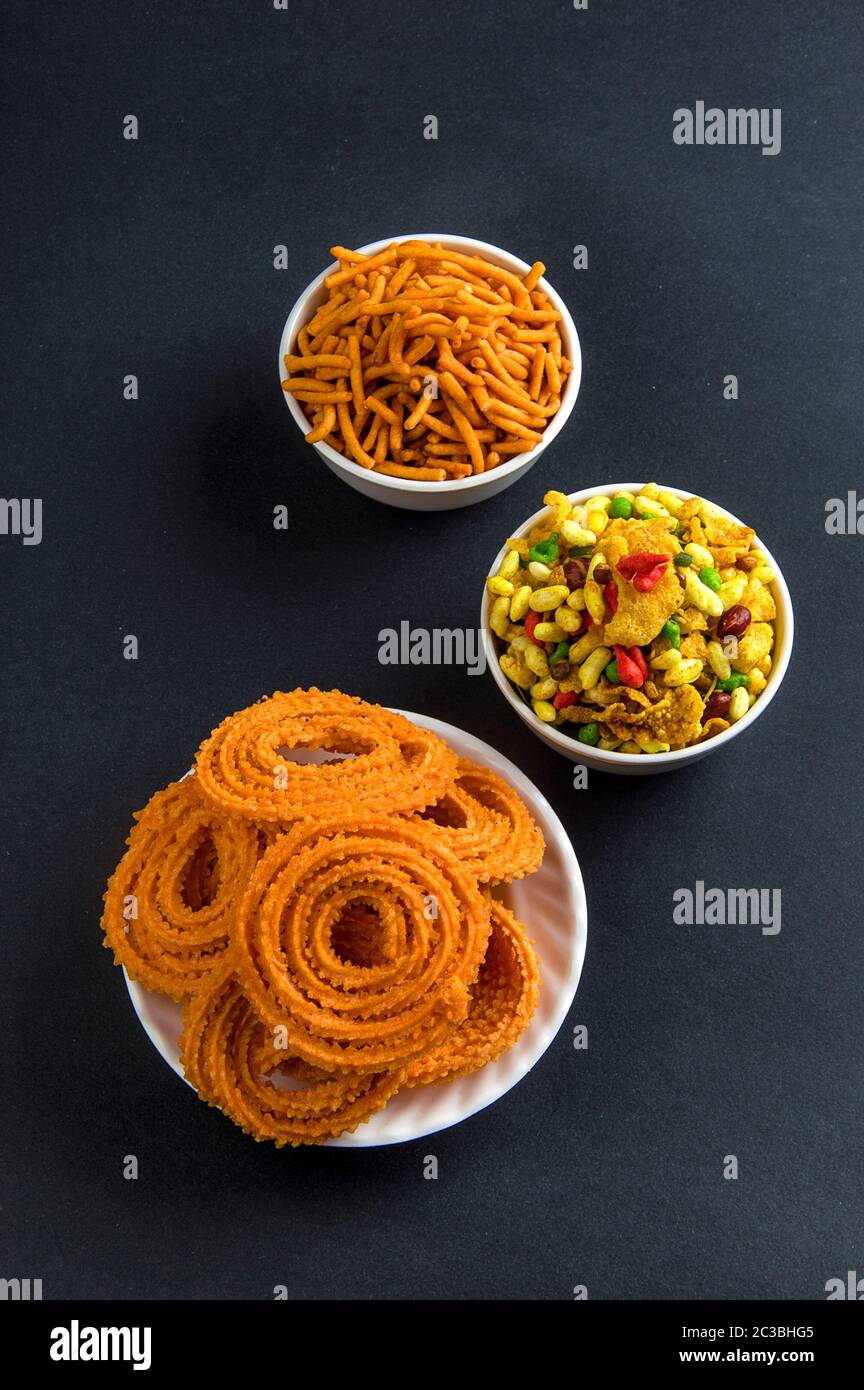 Indian Snack : Chakli, chakali or Murukku and Besan (Gram flour) Sev and chivada or chiwada. Diwali Food Stock Photo