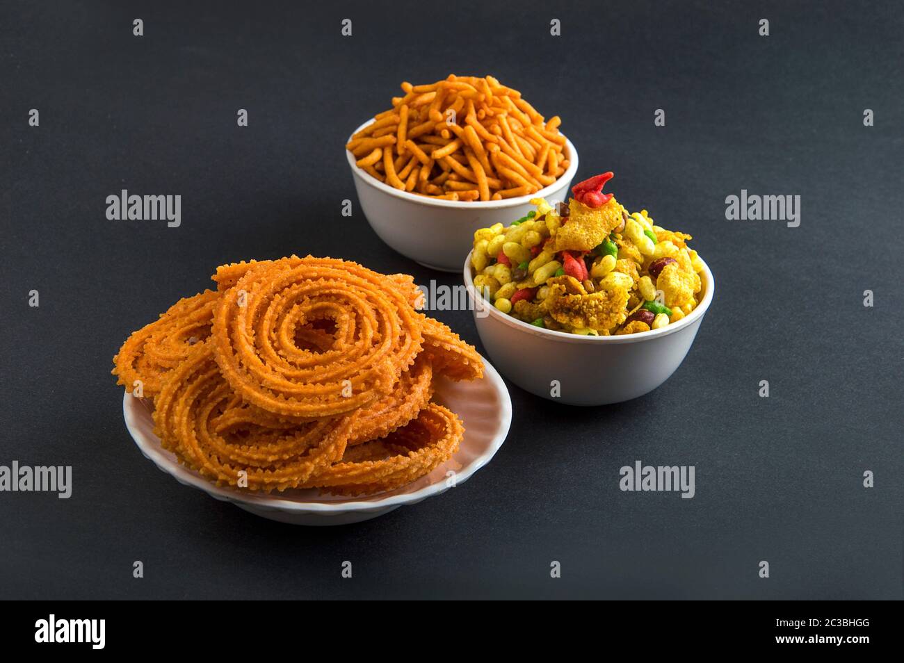 Indian Snack : Chakli, chakali or Murukku and Besan (Gram flour) Sev and chivada or chiwada. Diwali Food Stock Photo