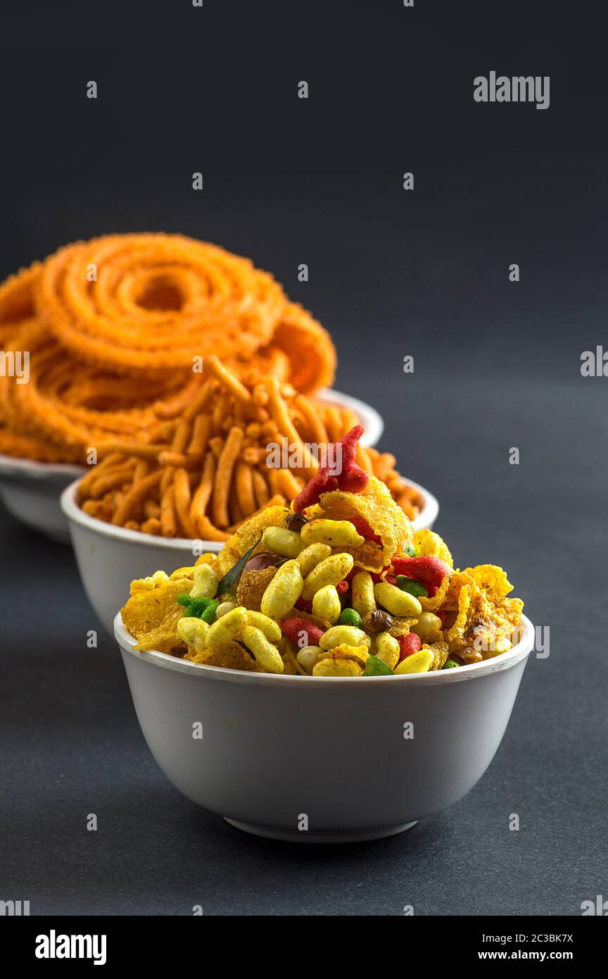 Indian Snack : Chakli, chakali or Murukku and Besan (Gram flour) Sev and chivada or chiwada. Diwali Food Stock Photo