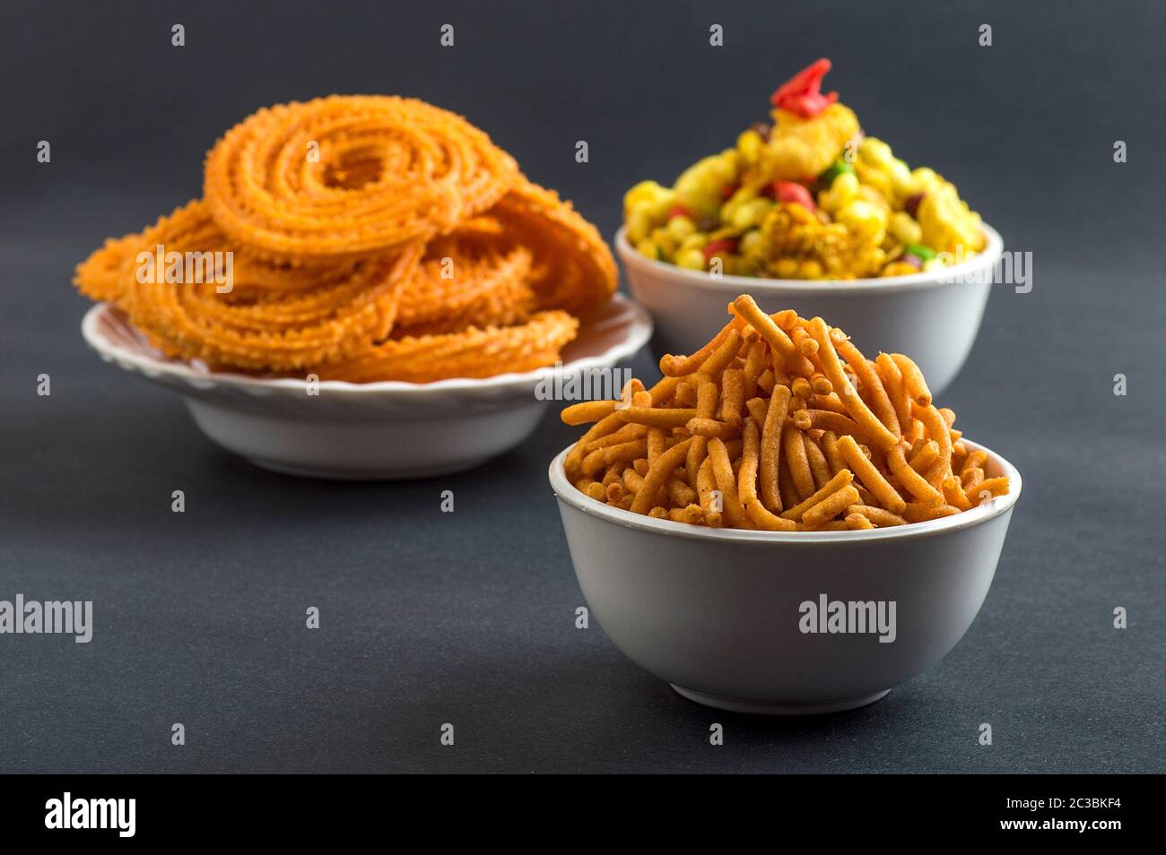 Indian Snack : Chakli, chakali or Murukku and Besan (Gram flour) Sev and chivada or chiwada. Diwali Food Stock Photo