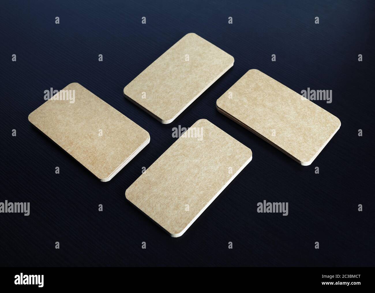 Photo of blank kraft paper business cards stacks. Template for branding