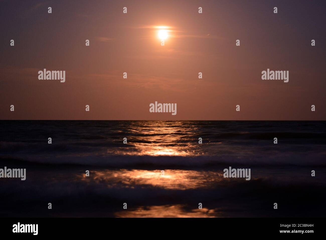 The moon reflected on the sea stock photo alamy