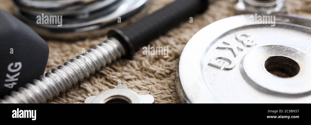Bunch of metal dumbbell disks lying around Stock Photo