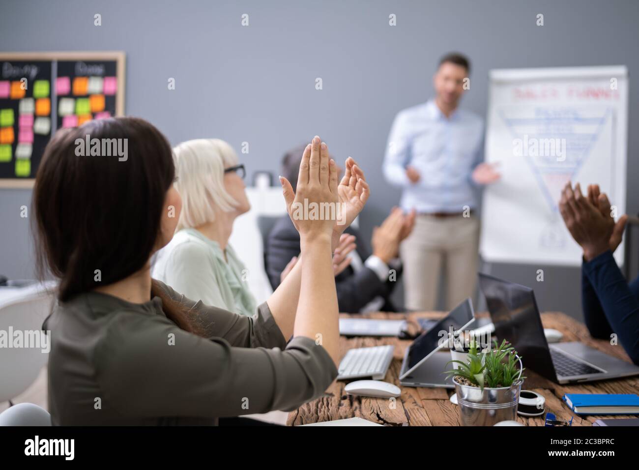 Group Of Successful Business People At The Lecture Asking Questions