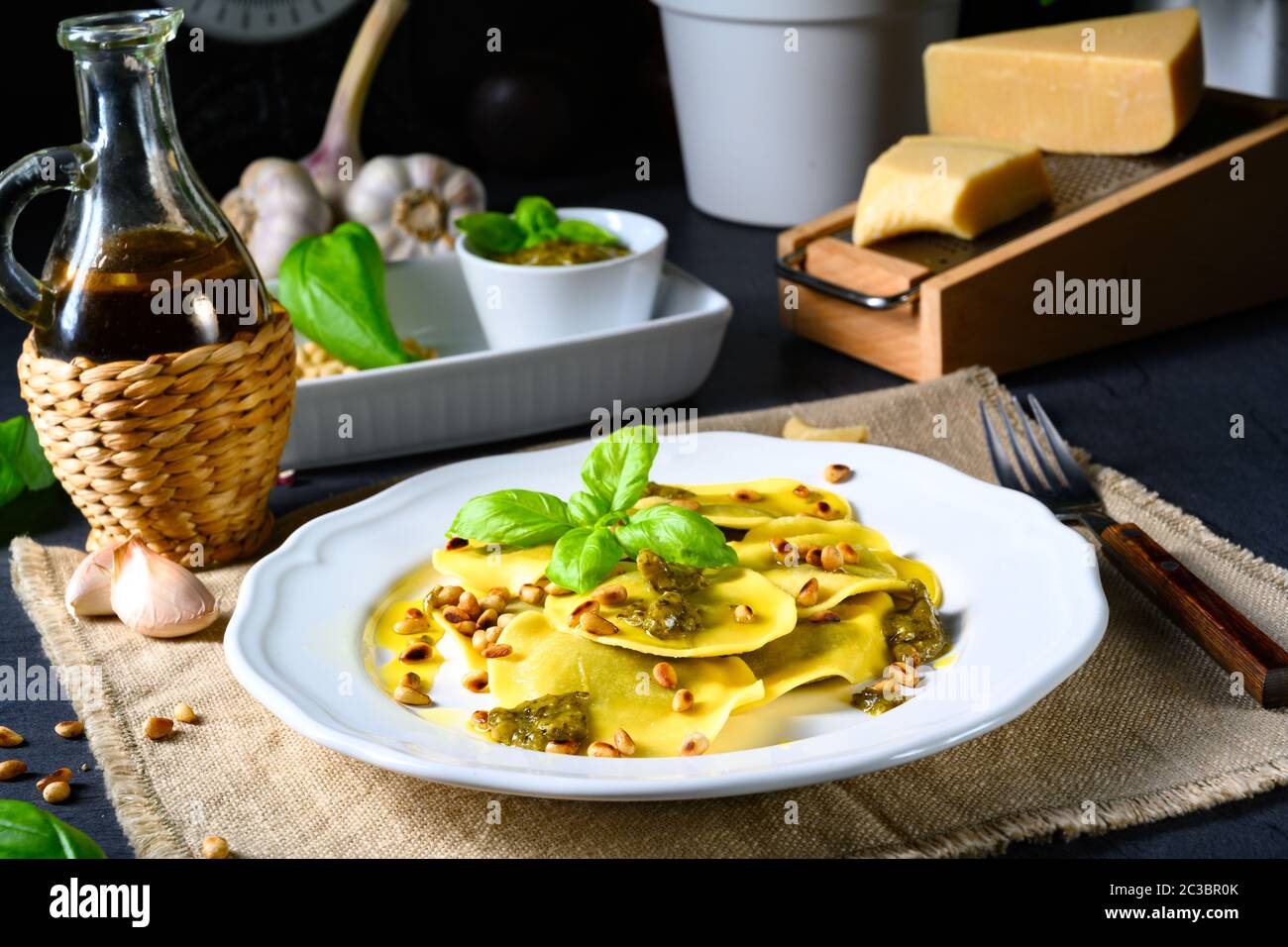 Vegetariano italiano! Tortelli with roasted pine nuts and pesto basilico Stock Photo
