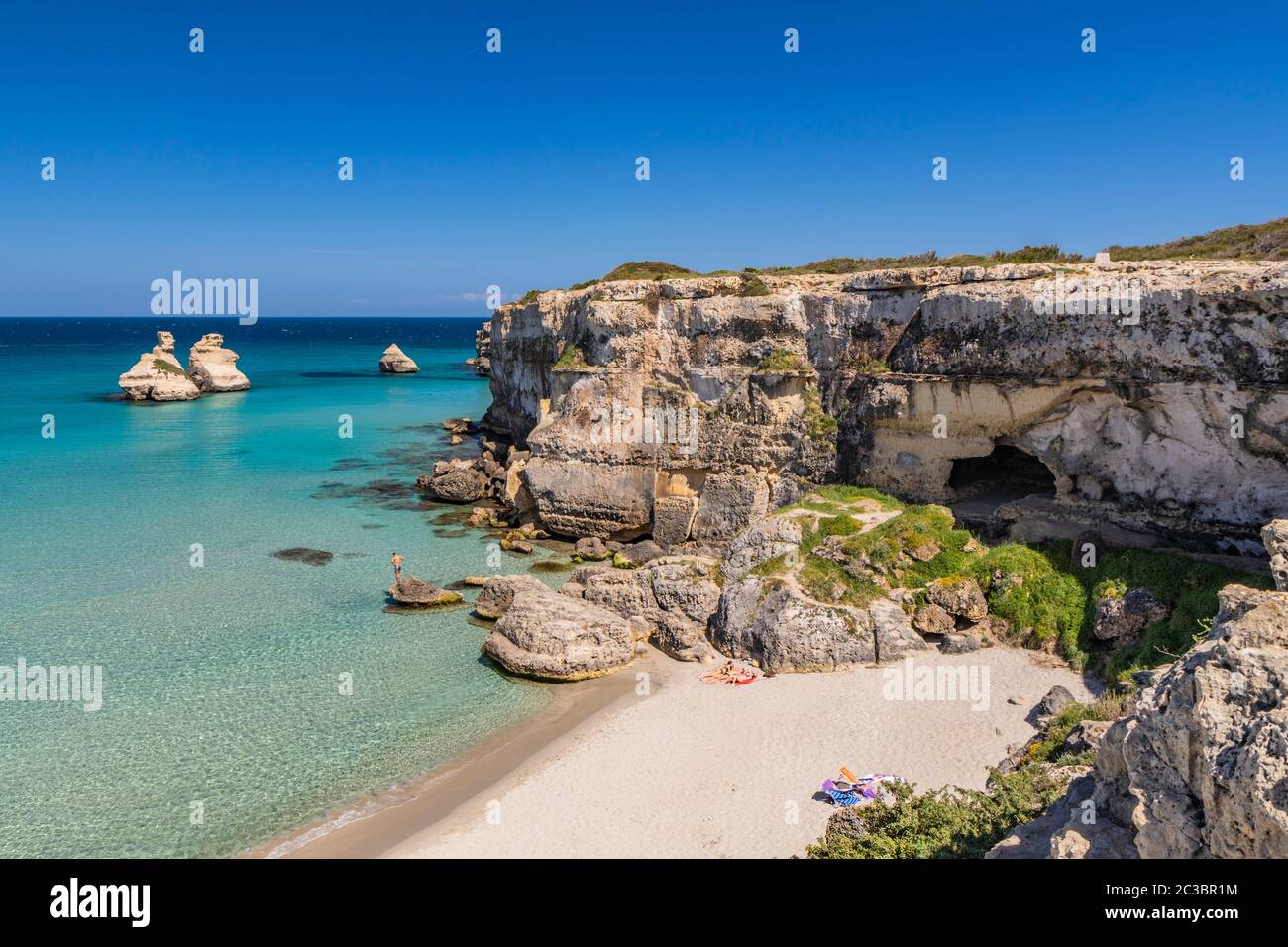 The bay of Torre dell'Orso, with its high cliffs, in Salento, Puglia ...