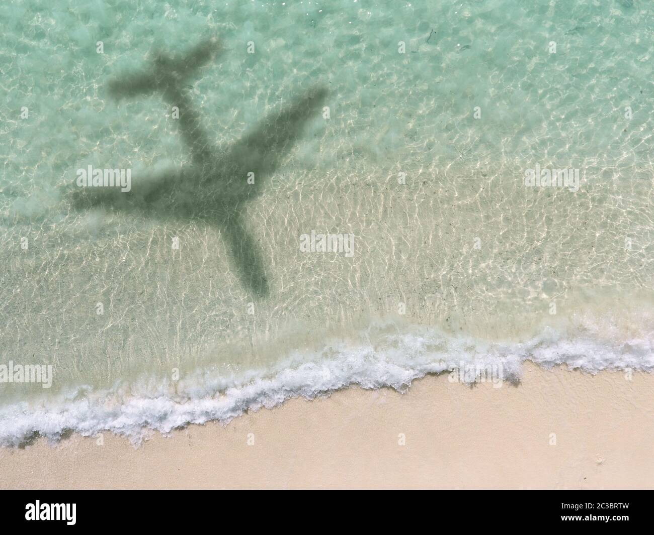 Shadow of a plane over a beach hi-res stock photography and images - Alamy