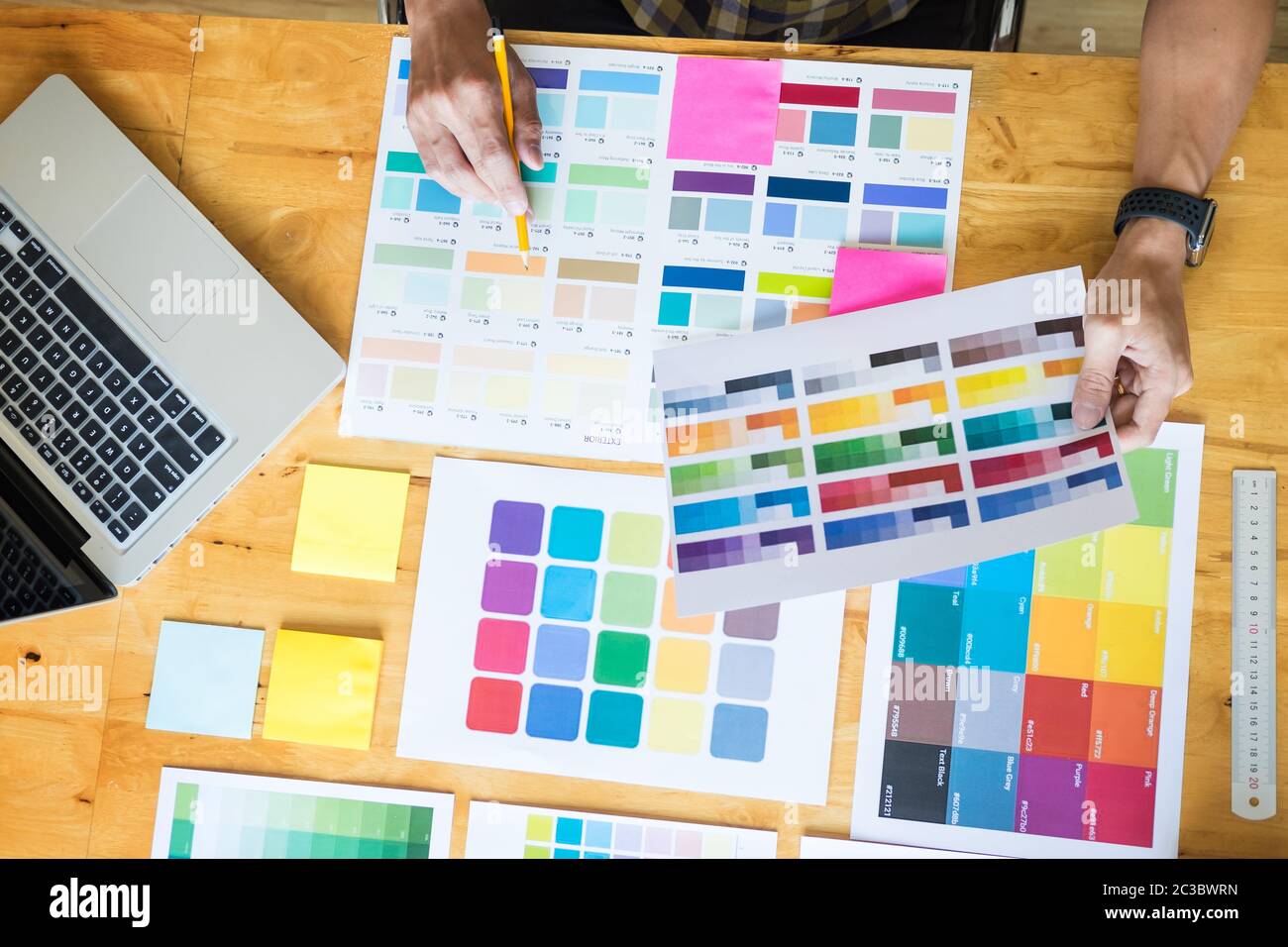 Creative Graphic designer at work. Color swatch samples pantone palette