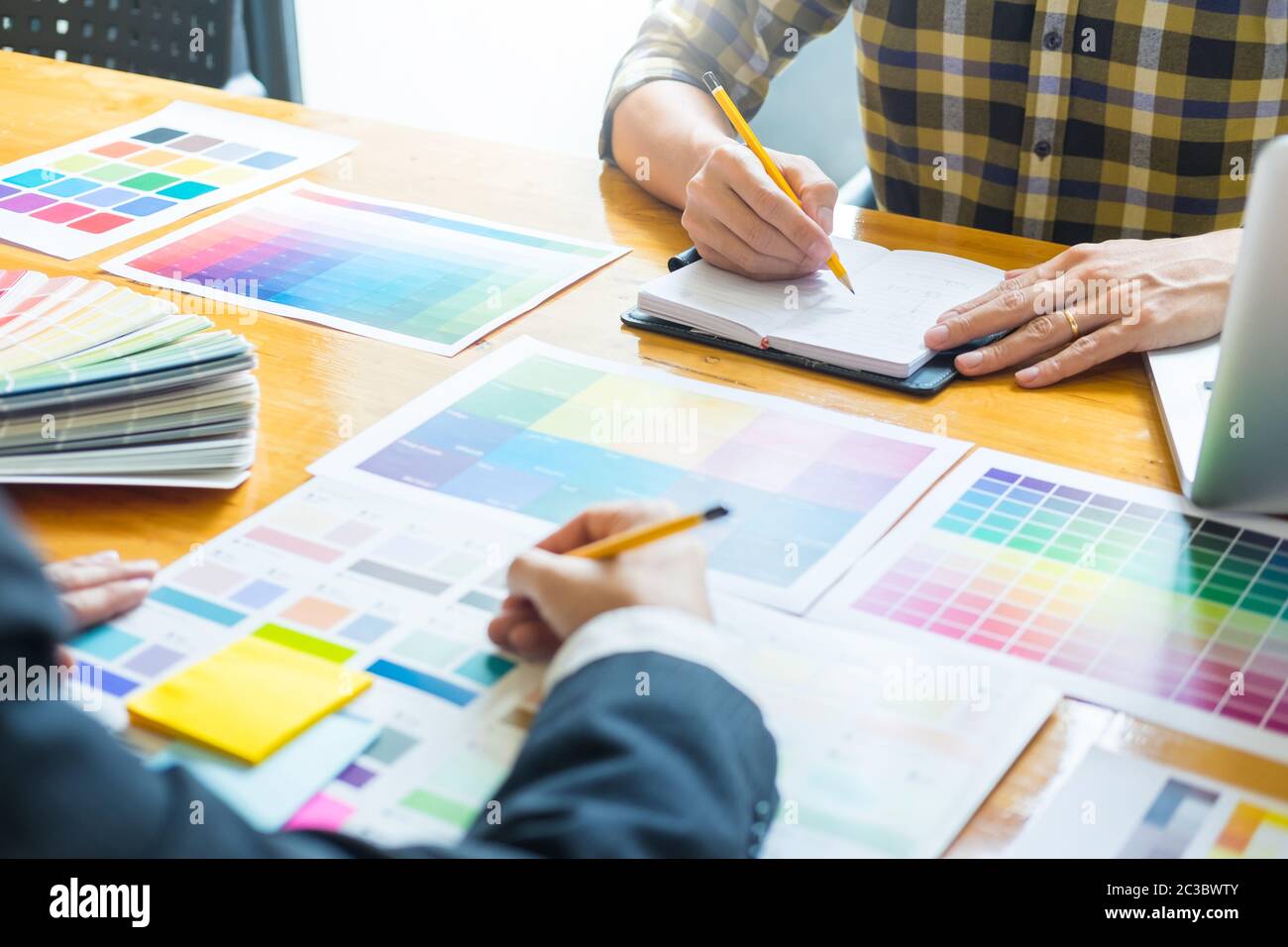 Creative Graphic designer at work. Color swatch samples pantone palette