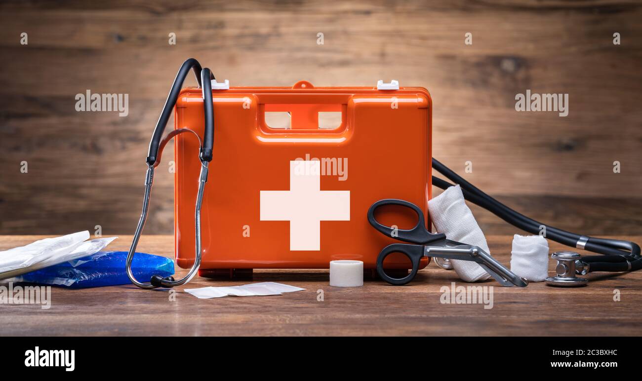 First Aid Kit With Medical Equipment On Wooden Background Stock Photo ...