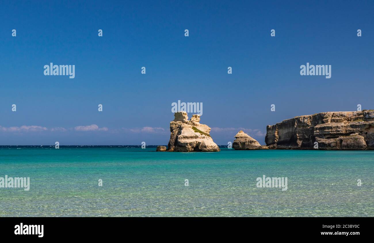 The bay of Torre dell'Orso, with its high cliffs, in Salento, Puglia ...