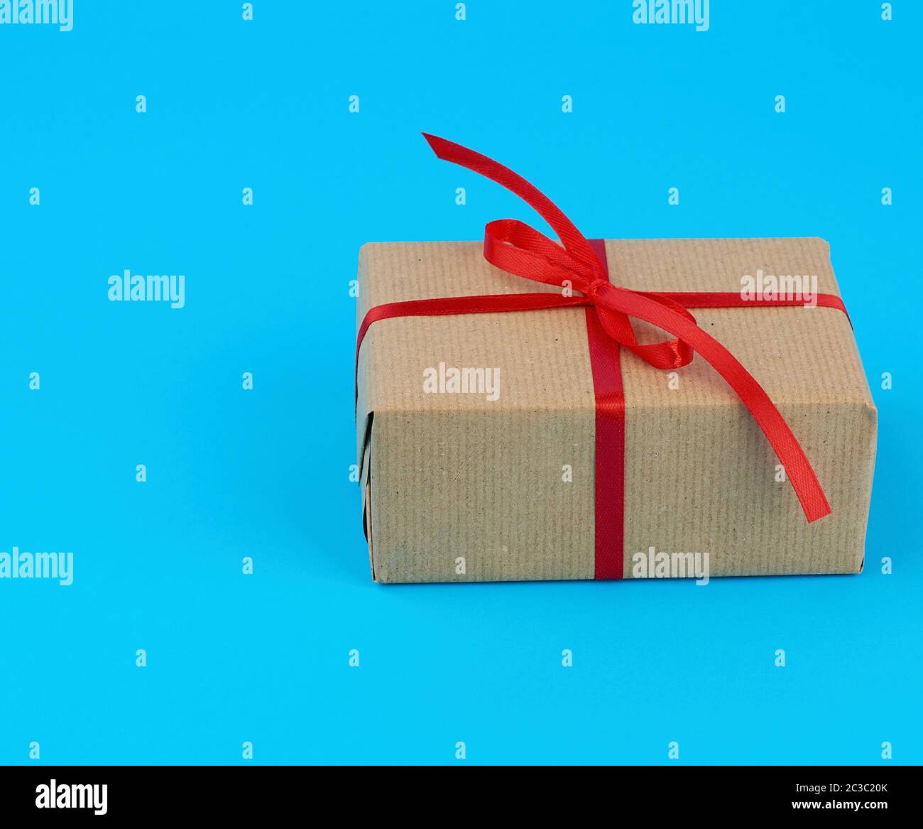 Brown Paper Parcel With Thin Tied Rope Package or Present Isolated On White  Background Stock Photo - Alamy